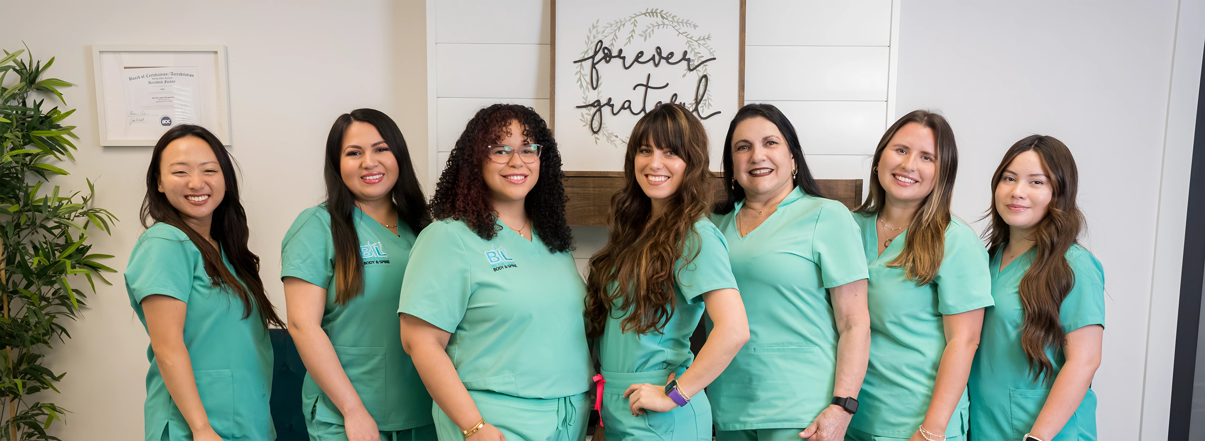 The Be The Light Body & Spine team in their Lawrenceville clinic